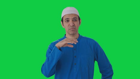 Muslim-man-disgusted-by-bad-smell-Green-screen