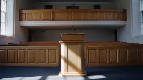empty wooden hall with podium and balcony