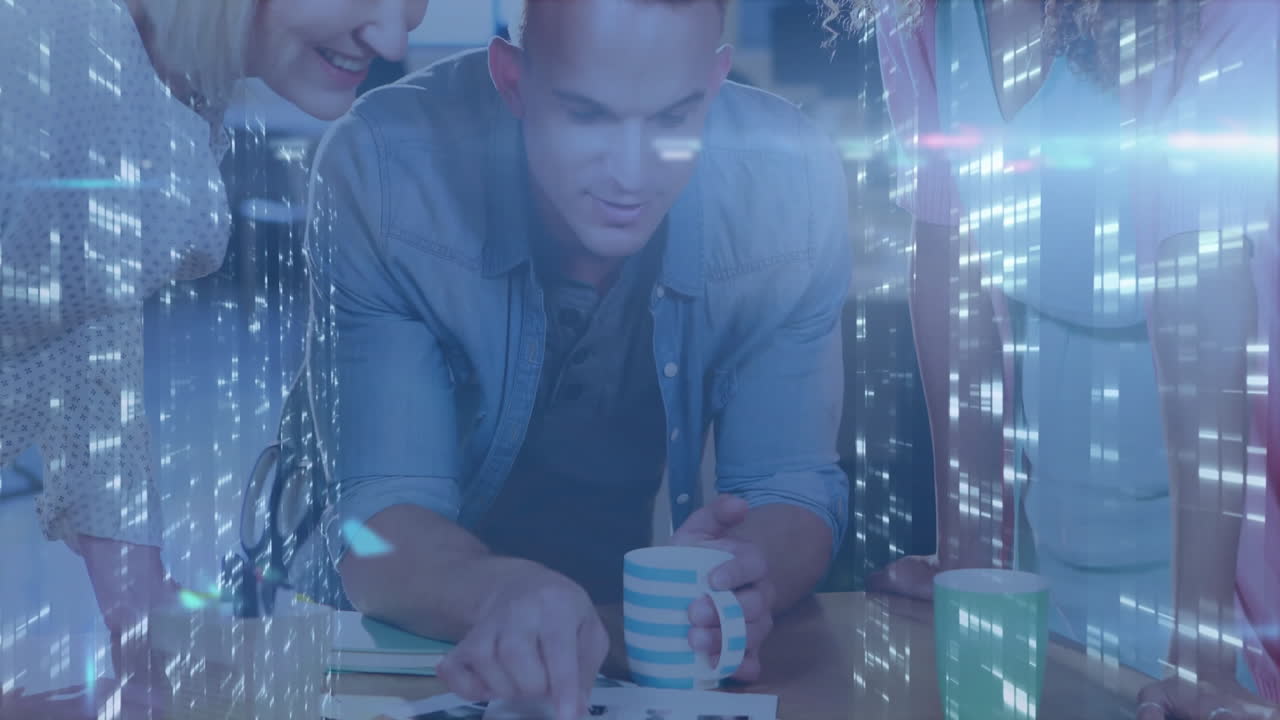 Diverse group at office table with digital data processing animation overlay