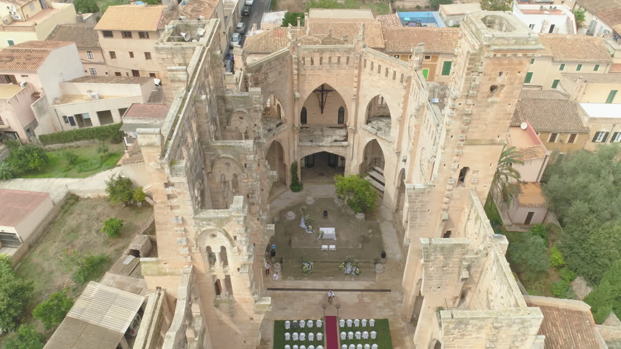 Aerial View of a Wedding Ceremony Setup in Historic Church Ruins