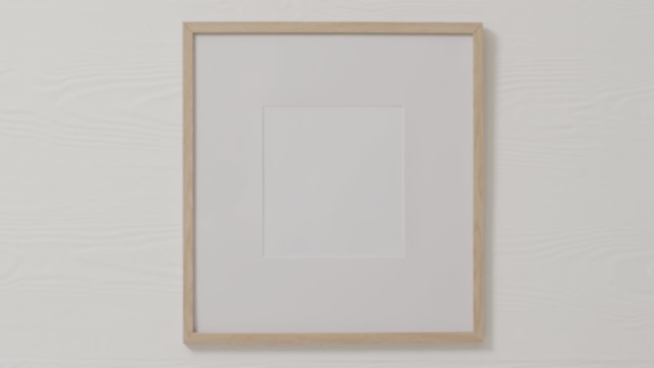 Wooden frame with copy space against white wall
