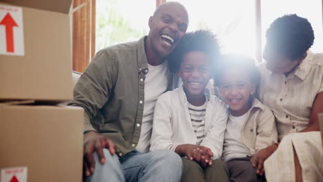 Happy-black-family,-box-and-relax-in-new-home