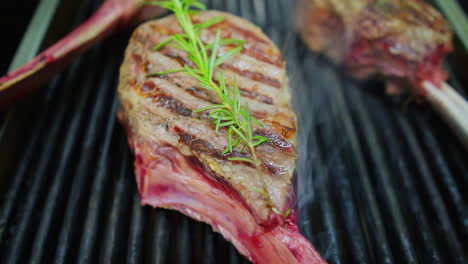 shot of raw tomahawk on the grill, milan - italy