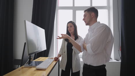 creative producer and editor are discussing photosession of footballer in studio backstage