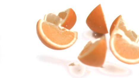 sliced orange falling in super slow motion