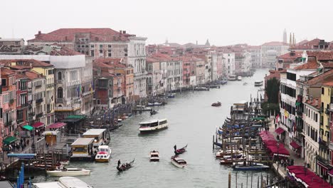 venice italy bustling market with gondola boats transporting through grand canal by buildings