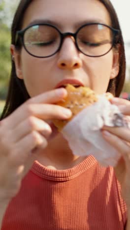 people eating sandwiches outdoors