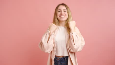 young woman celebrating joyful success with excitement
