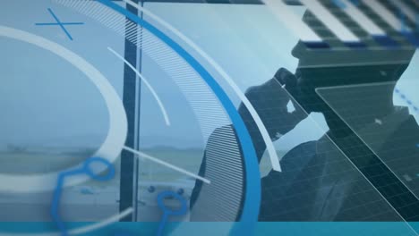 animation of data processing against caucasian businessman talking on smartphone at an airport