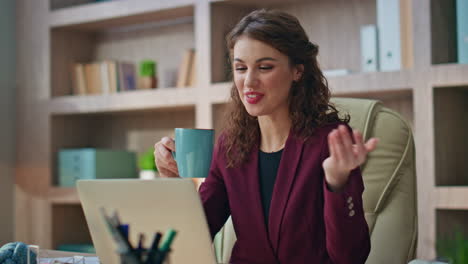 happy manager talking video conference in morning closeup. smiling worker call