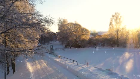 Snow-covered-winter-road-with-30-speed-sign-leading-to-rural-village-on-sunny-winter-day