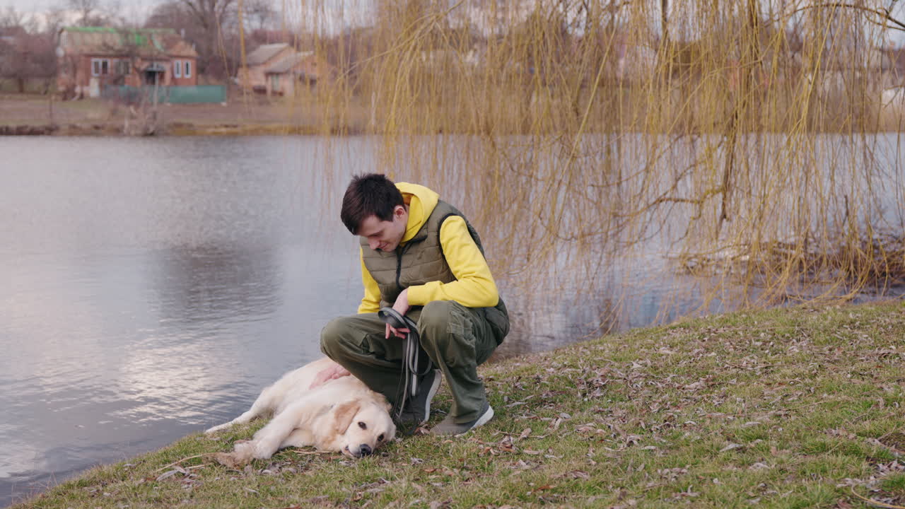 Man and dog by the lake
