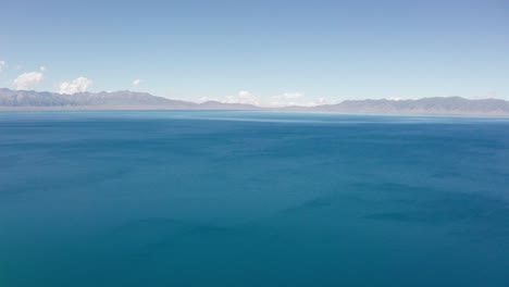 lake and mountains in a sunny day.