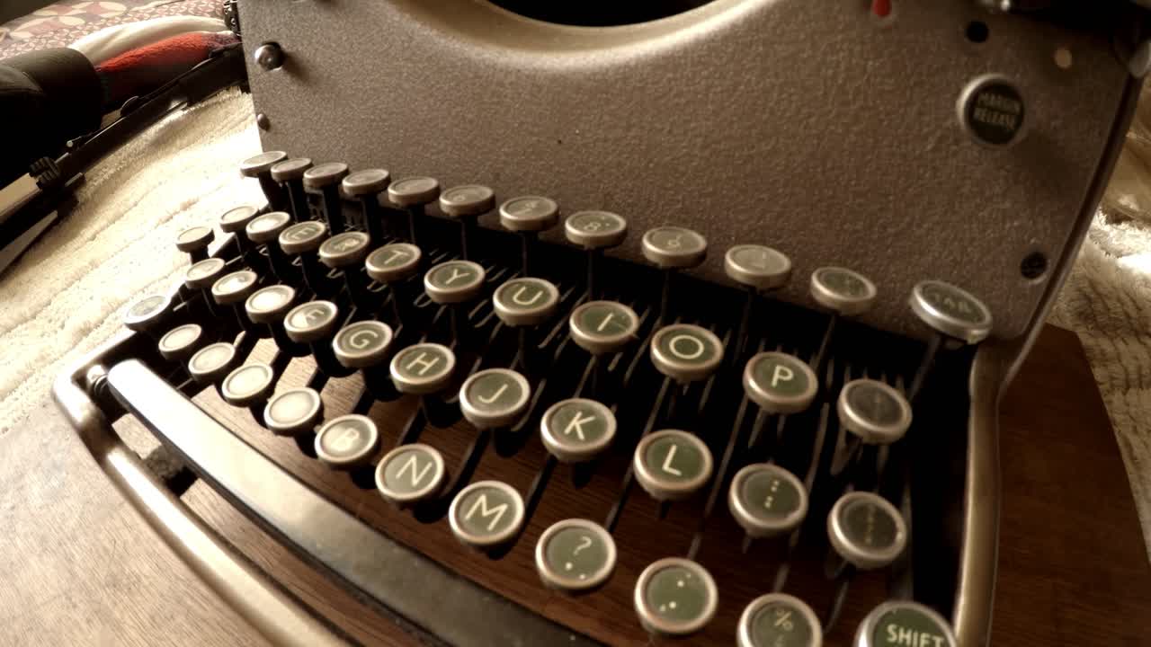 Panning shot across old typewriter keyboard