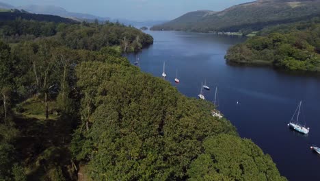 drone footage showing coniston lake in the lake district, cumbria, uk and looking north from the south of the lake