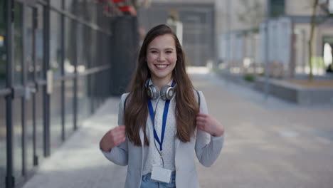 portrait young lively business woman student smiling excited enjoying professional urban lifestyle success in city slow motion corporate intern