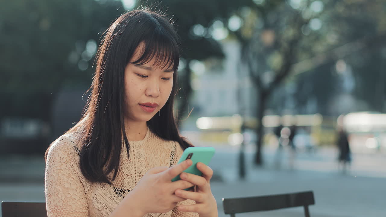 Woman using smartphone in the park