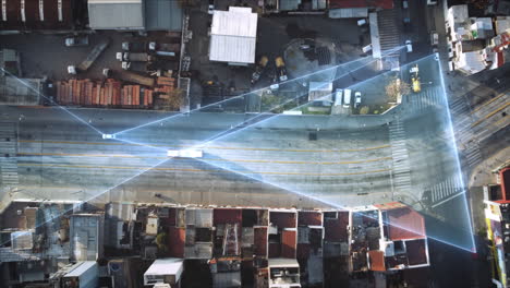 aerial birds eye tracking shot of car and truck driving on road connected by digital glowing lines - future concept and modern communication - vehicle mobility and technology in city