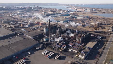 Industrial-area-in-hamilton,-ontario-with-factories-and-smokestacks,-aerial-view