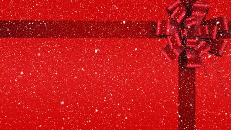 Digital-animation-of-red-ribbon-with-gift-bow-against-red-background-4k