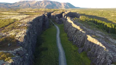 aerial shot of path way in the middle of the rocky mountain