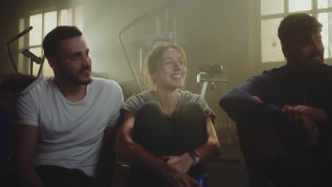 friends relaxing after a workout in gym