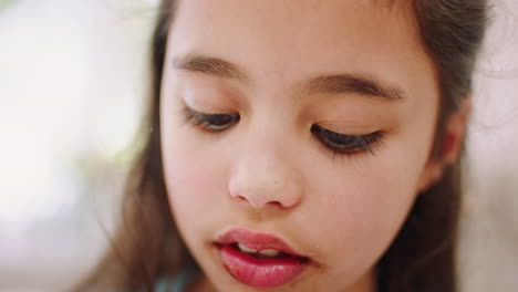 Closeup,-girl-child-and-licking-fingers