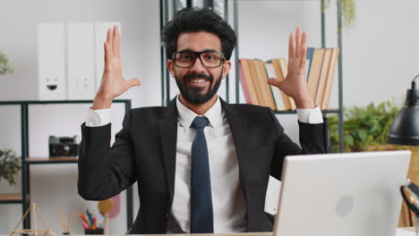 Businessman-working-at-home-office-taking-off-glasses,-shocked-by-sudden-victory,-lottery-winning