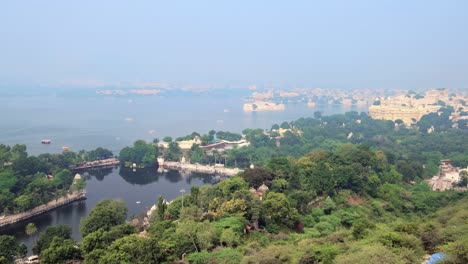 aerial view of lake pichola with lake palace jag niwas and udaipur city. udaipur, rajasthan, india