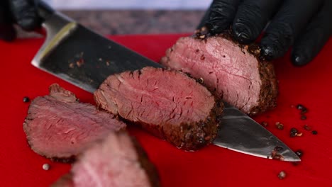 slicing a roasted beef tenderloin