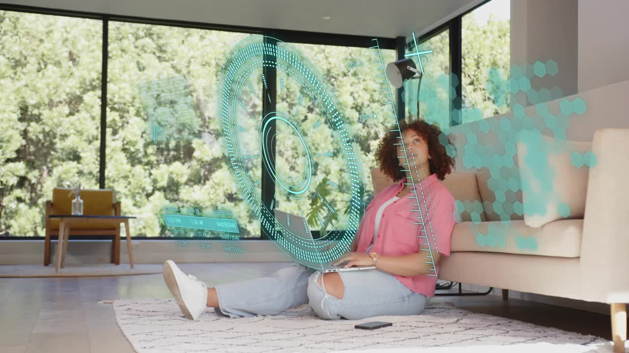 Woman typing on laptop in living room, teal holographic UI appearing and guiding tech data analysis