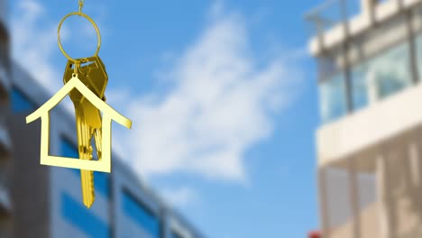 Animation-of-golden-house-keys-against-blurred-view-of-tall-buildings