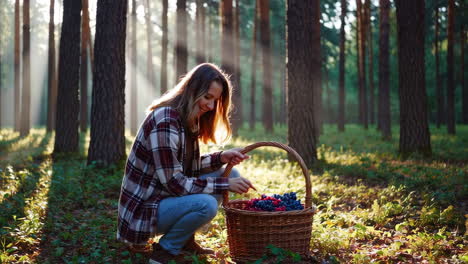woman picking berries in a forest
