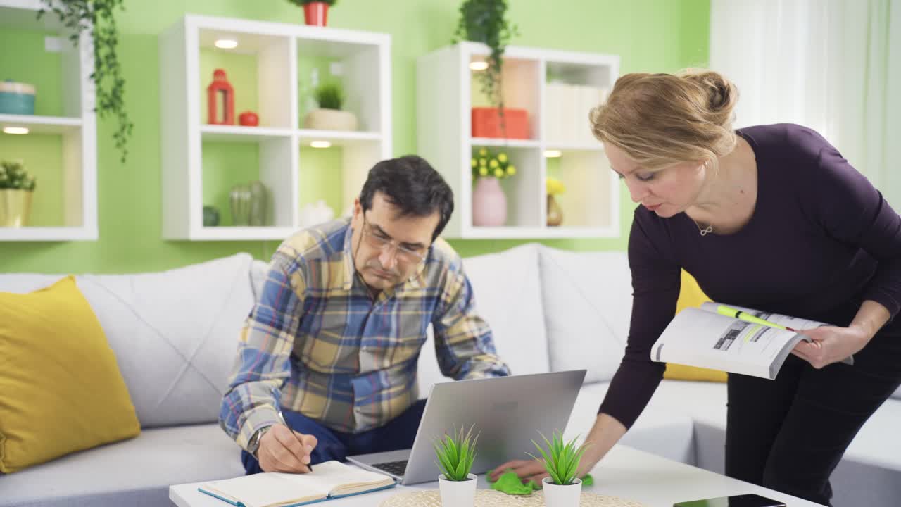 The man who can't do his work because of his cleaning addict wife gets angry and they argue with each other.