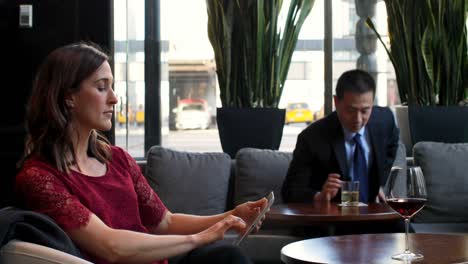 side view of beautiful caucasian businesswoman working on digital tablet in the modern hotel 4k