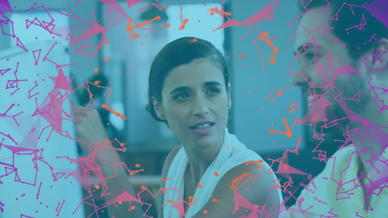 Vertical video: She pointing at screen guiding man while pink orange net moving over faces for biz
