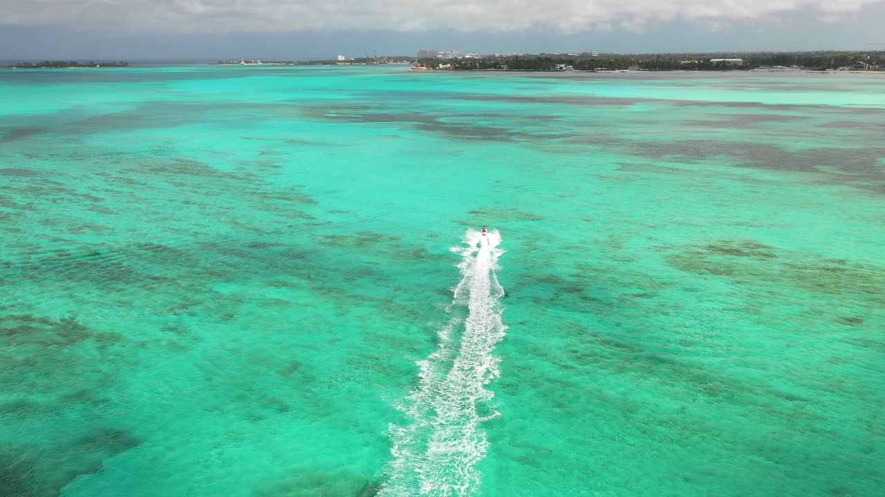 PWC Jet Ski in Exotic Turquoise Water on Bahamas Coast, Nassau, Drone Aerial View