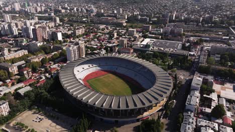 cinematic orbiting drone shot above boris paichadze dinamo stadium
