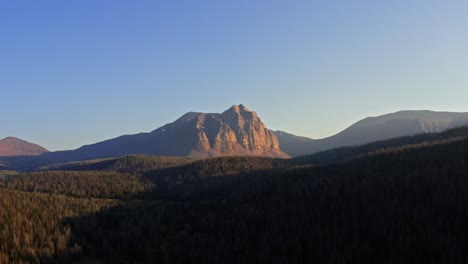 stunning aerial drone landscape nature dolly in shot of the beautiful red castle lake mountain up in the high uinta's between utah and wyoming on a backpacking trip on a clear summer evening