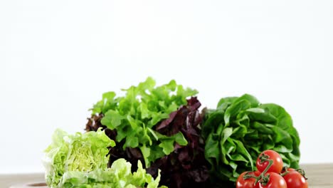 leafy vegetables on wooden table