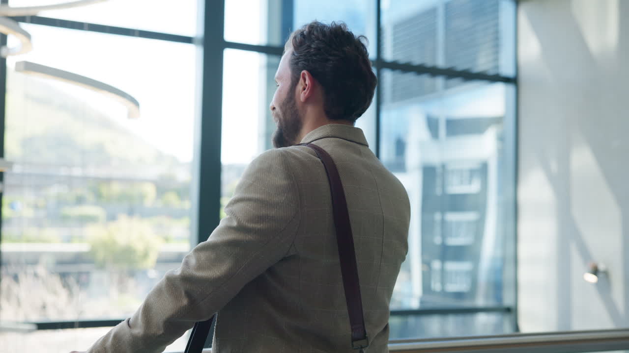 Man on a Phone Call in a Modern Office