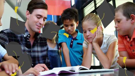 Graduation-cap-icons-falling-over-caucasian-male-teacher-teaching-students-at-elementary-school