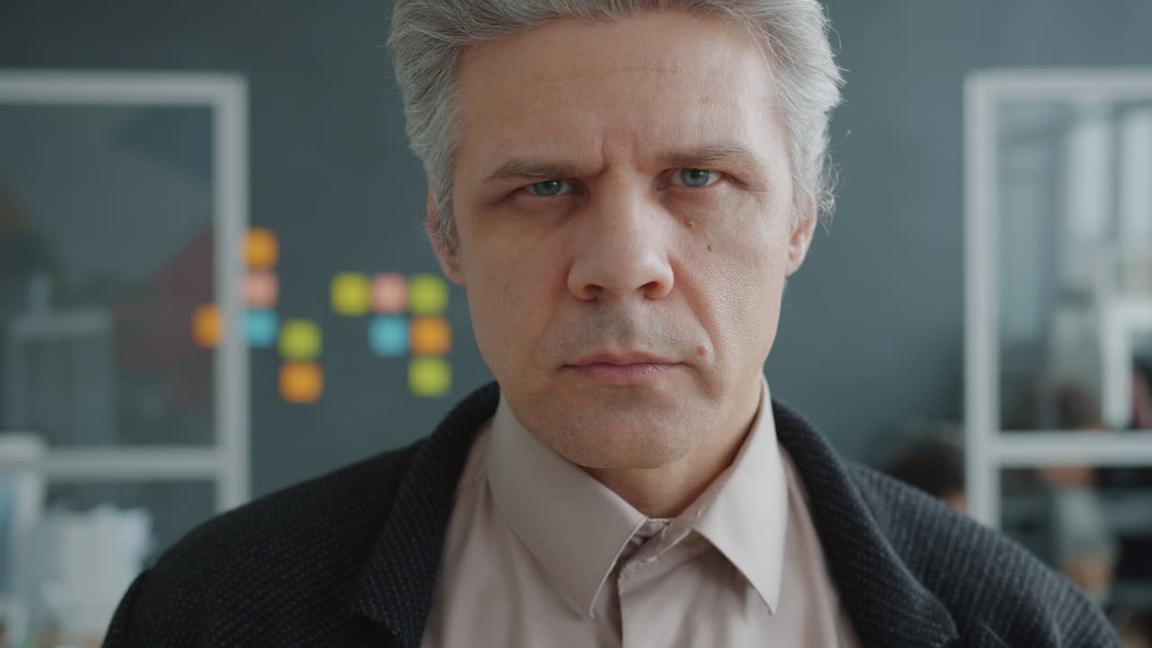 Close-up portrait of a man in an office setting