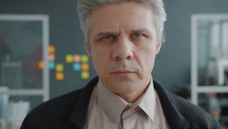 close-up portrait of a man in an office setting