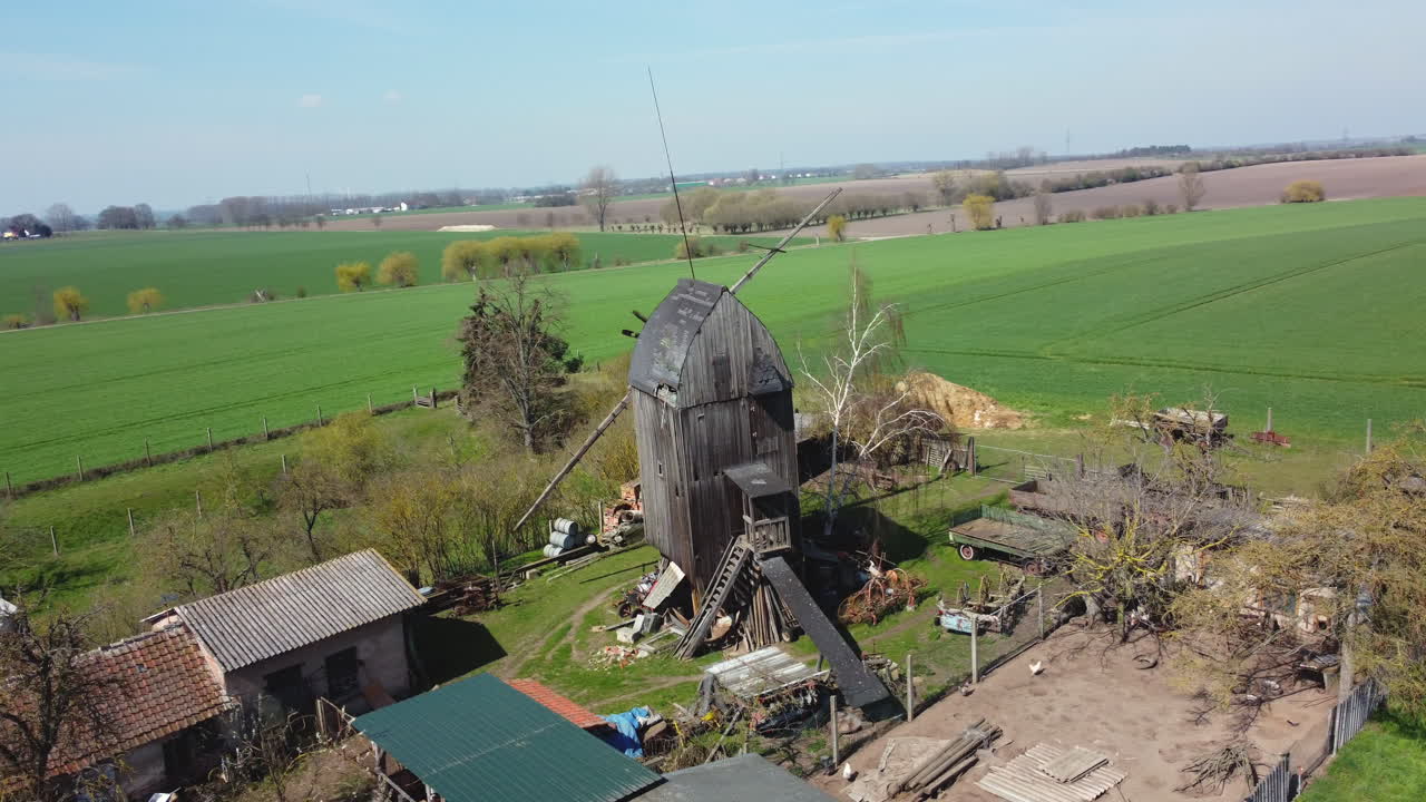 Old Wooden Windmill on a Farm