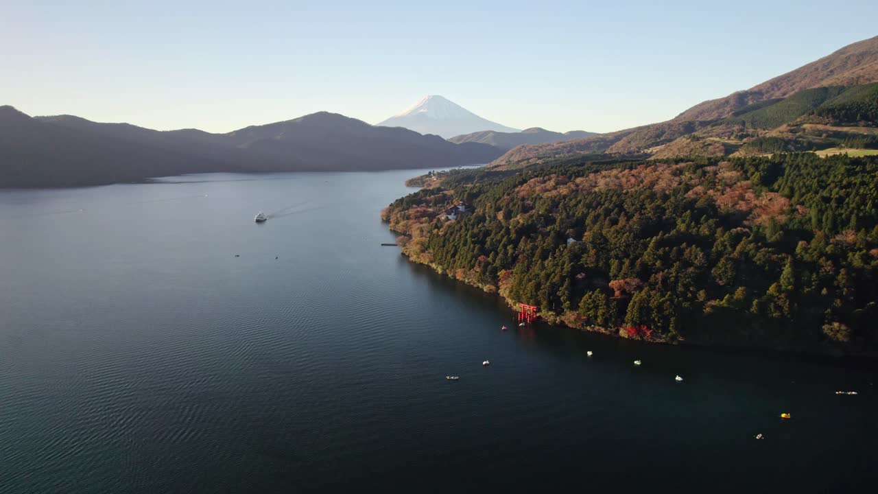 Scenic drone footage capturing Hakone’s famous Lake Ashi with torii gate and sightseeing boat