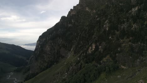 Drone-shot-on-the-solo-hike-to-hampta-pass-,-himachal-pradesh-having-lush-green-mountains-in-the-background