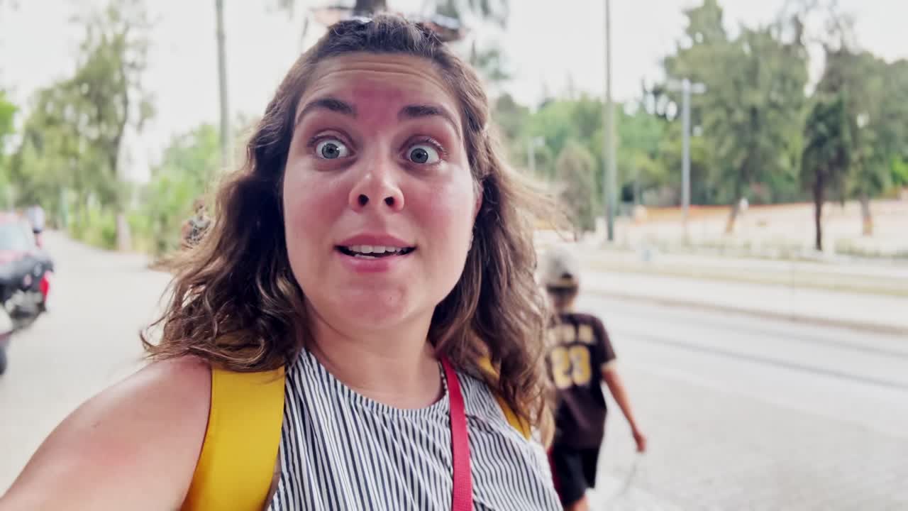 Happy Young Woman Smiling Outdoors with a Sun-Kissed Forehead