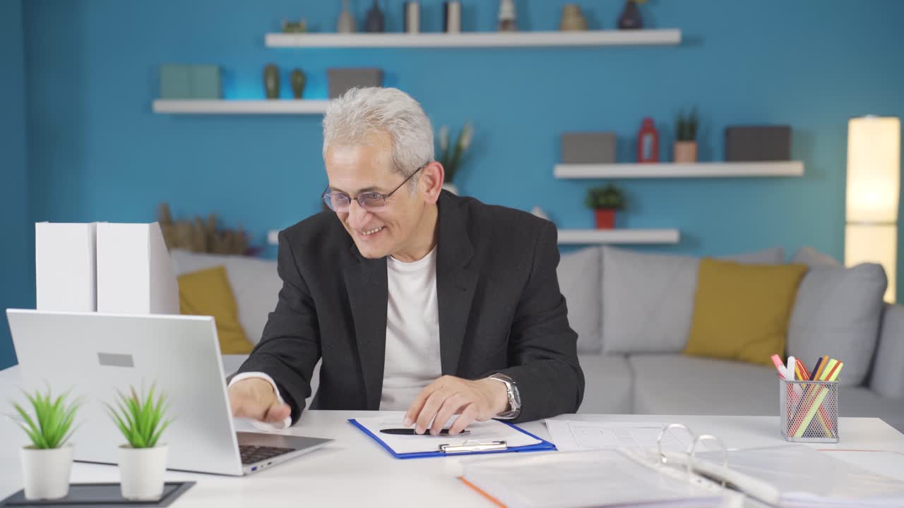 Home office worker man experiencing joy.