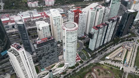 drone flight over the buildings of lomas de santa fe in mexico city, economic and financial center